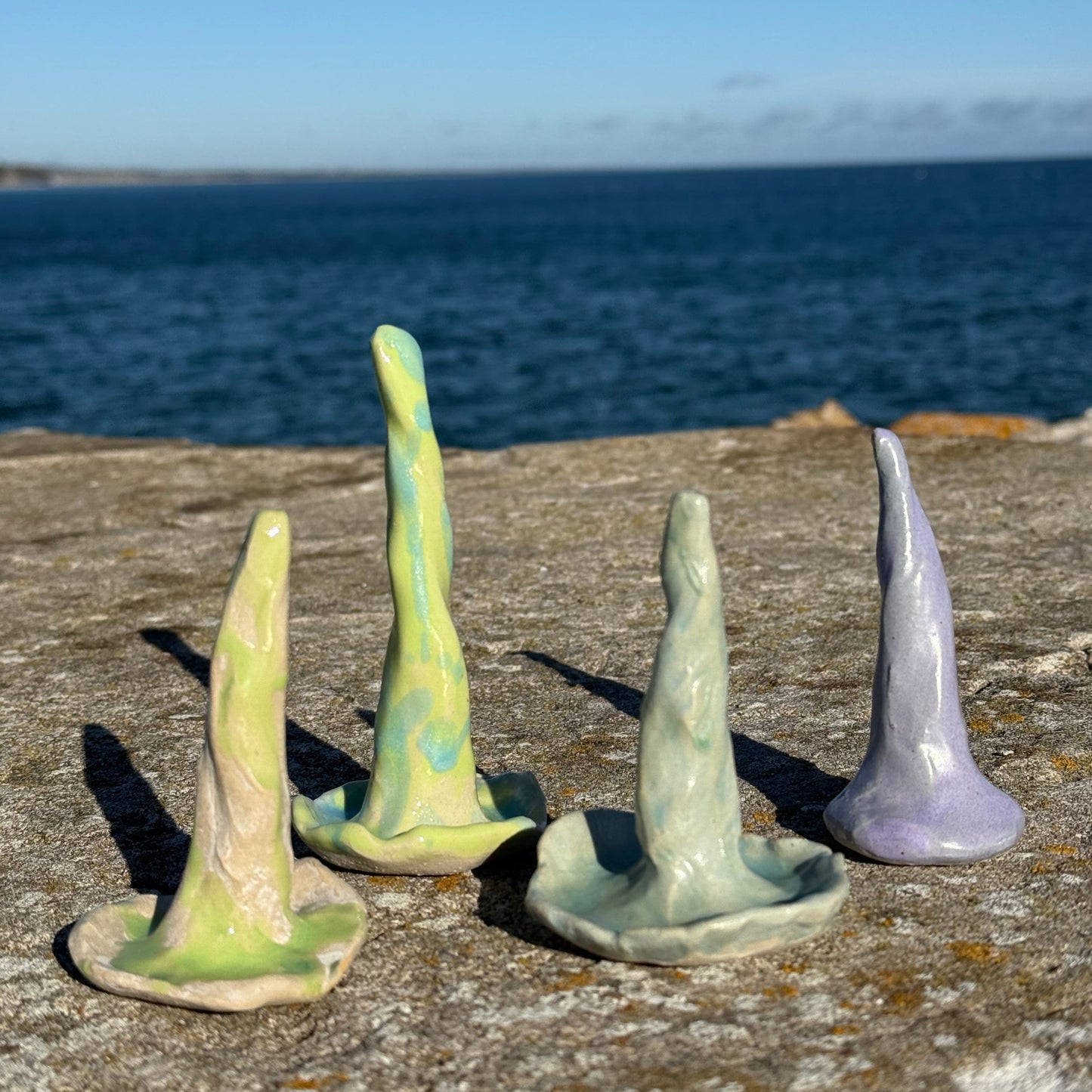 colorful ceramic ring cones on a rough pier by th sea