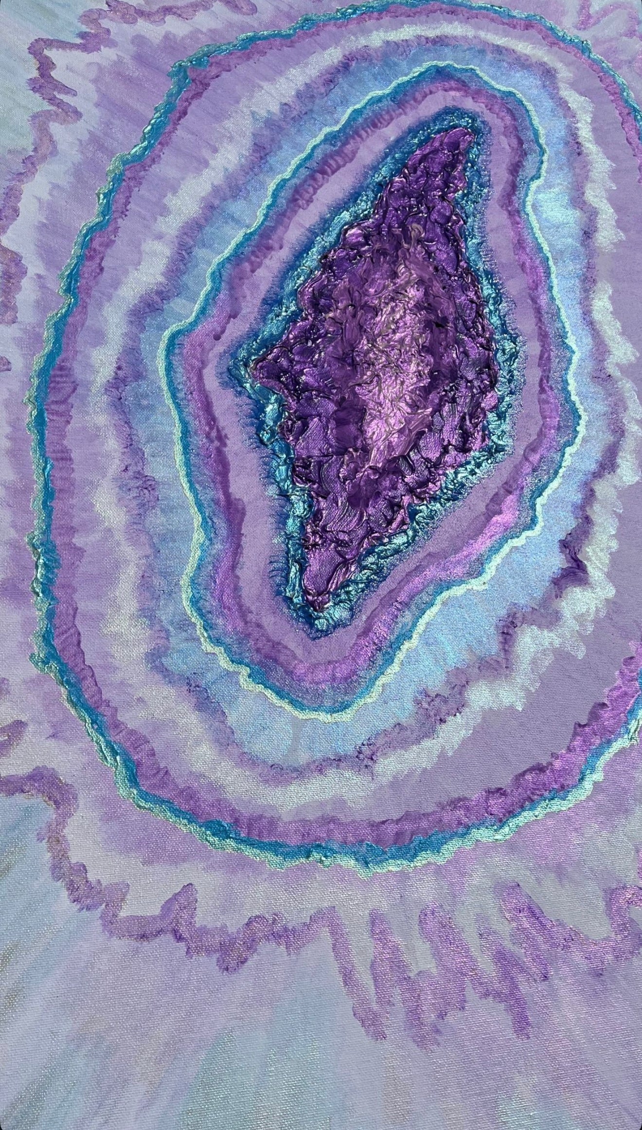Close-up of a purple and white geode pattern looking like a yoni or a universe