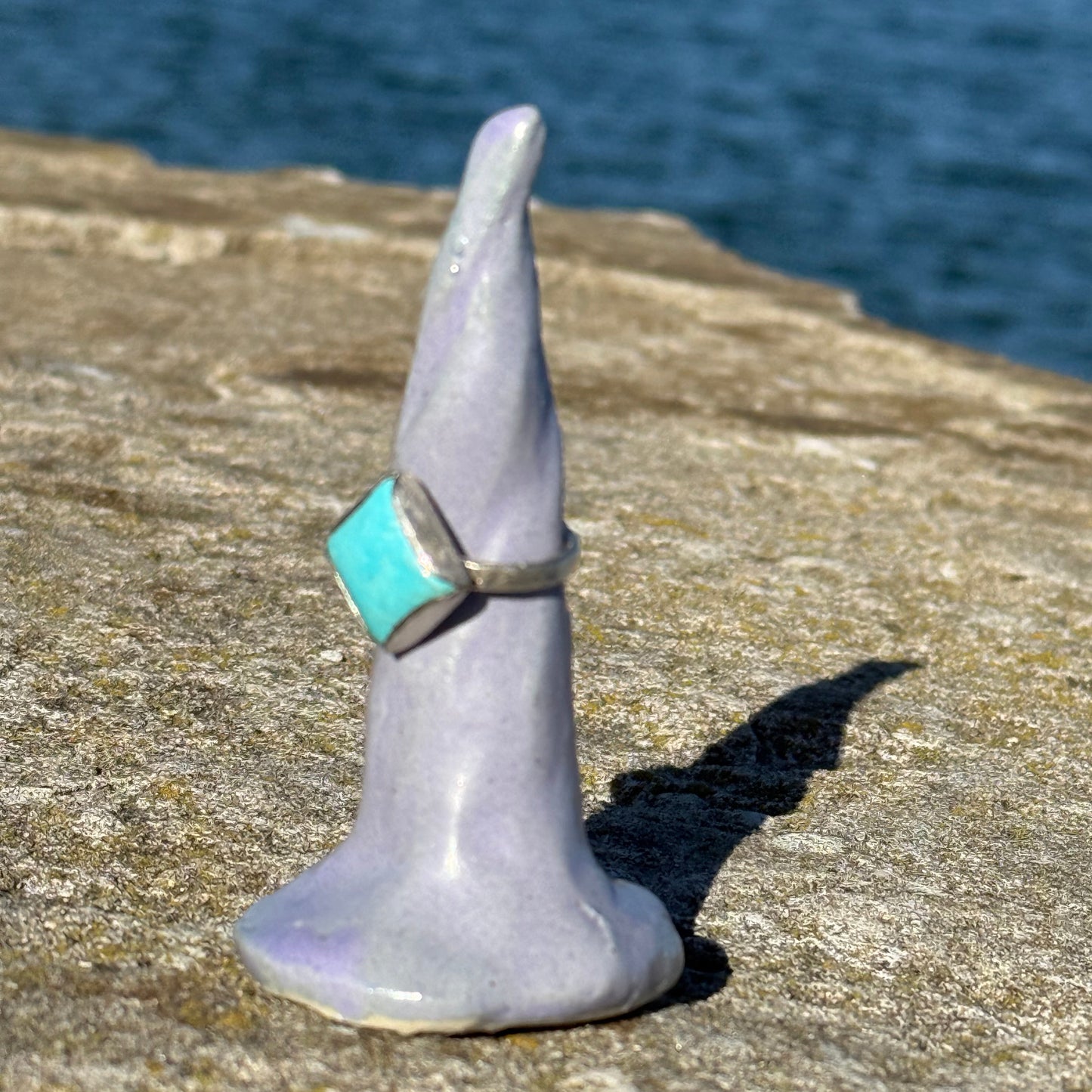 purple ceramics ring cone with turquoise silverring on it