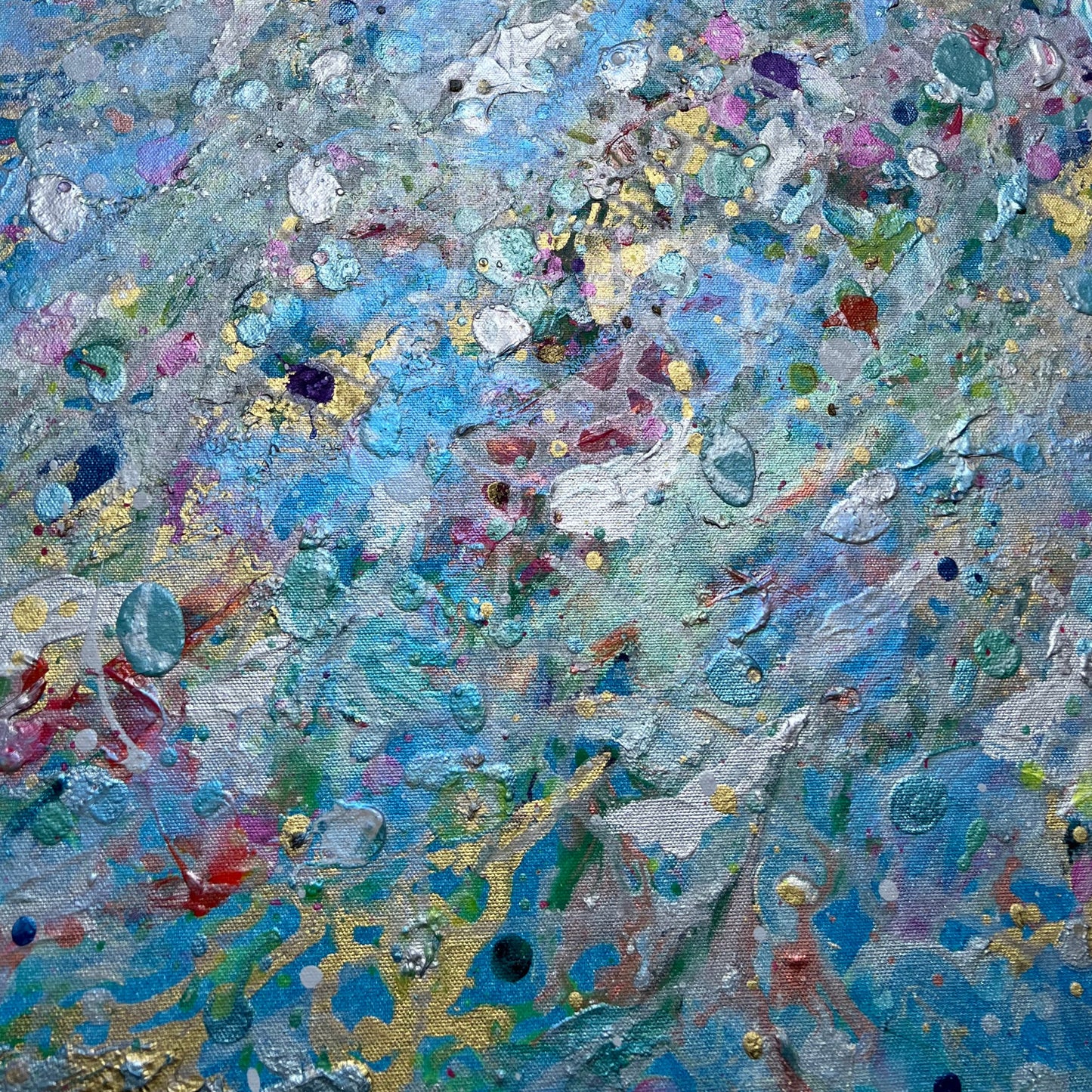 Abstract artwork with a mix of blue, turquoise, green, gold, pink, purple, and yellow colors.