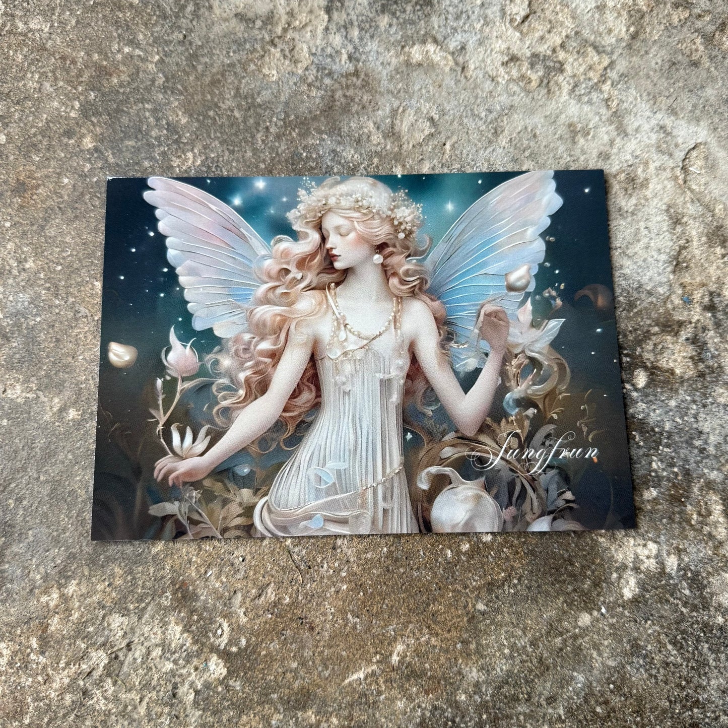 Fairy card with detailed artwork of star sign virgo on a textured surface
