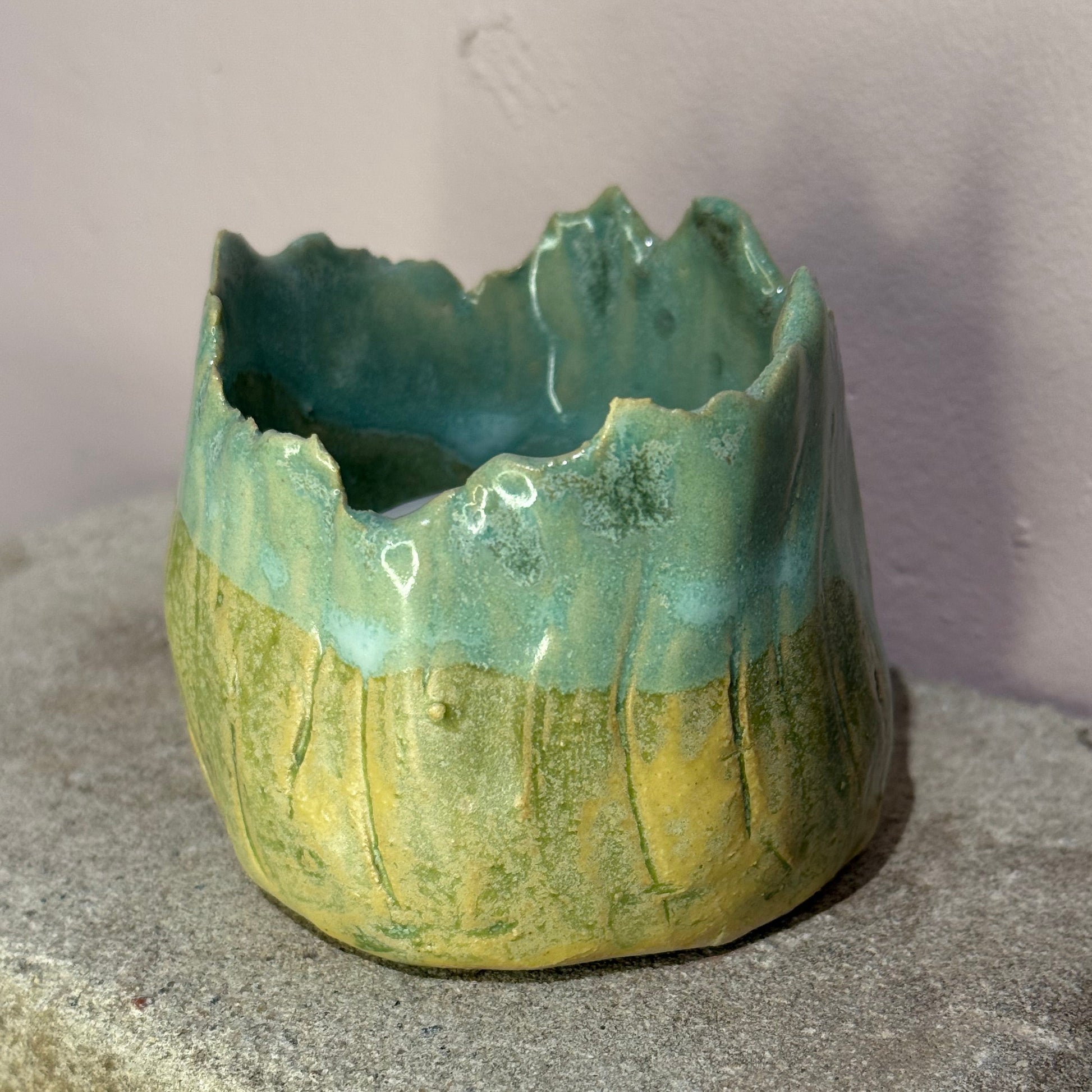 ceramic candle holder on a textured surface