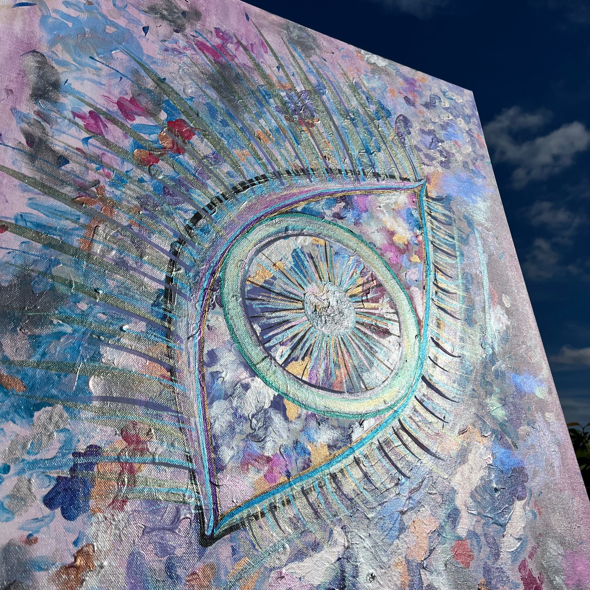 Colorful abstract artwork with a eye of mintaka design on a textured surface.