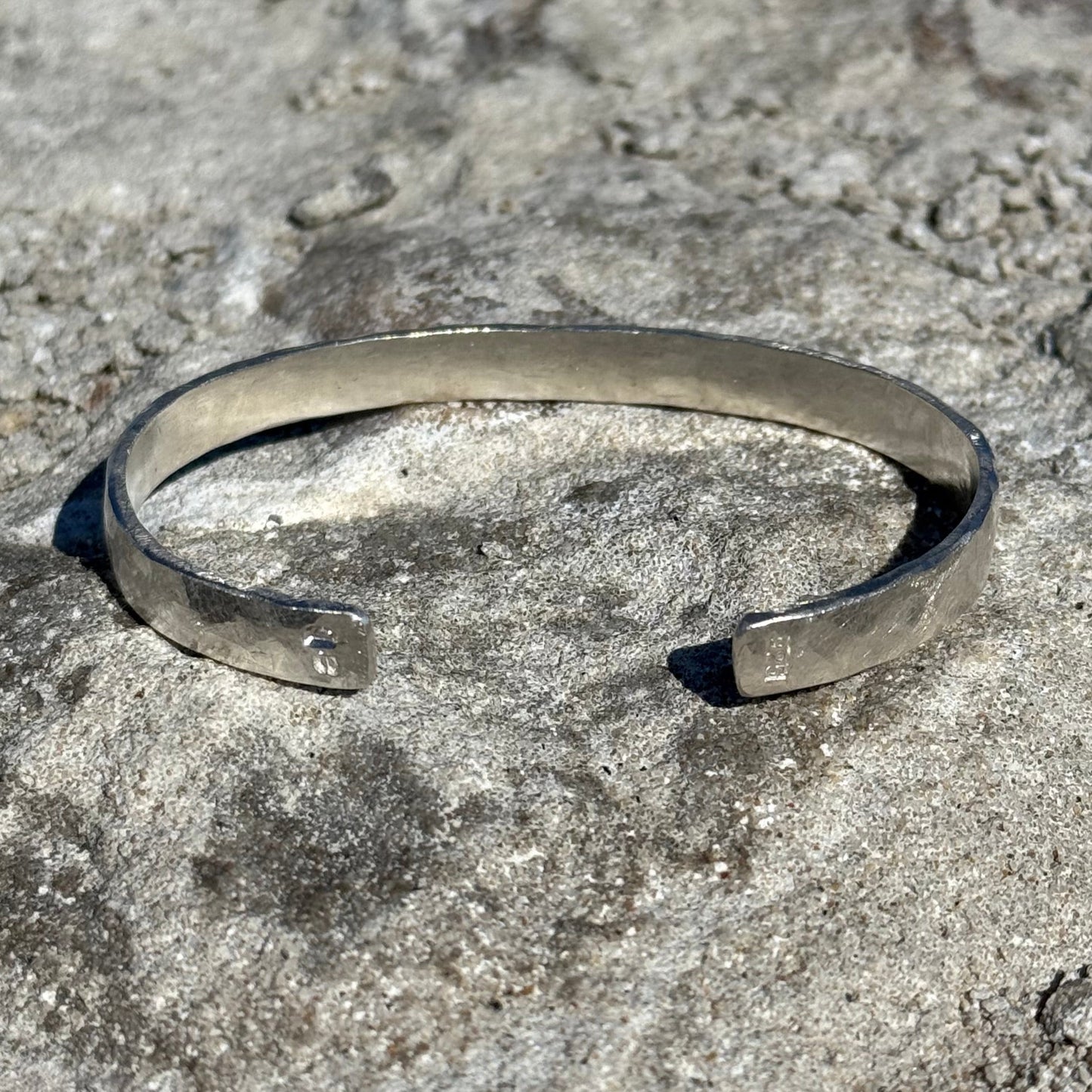 chunky silver cuff in hammered sterling silver with 925 stamped on the edge