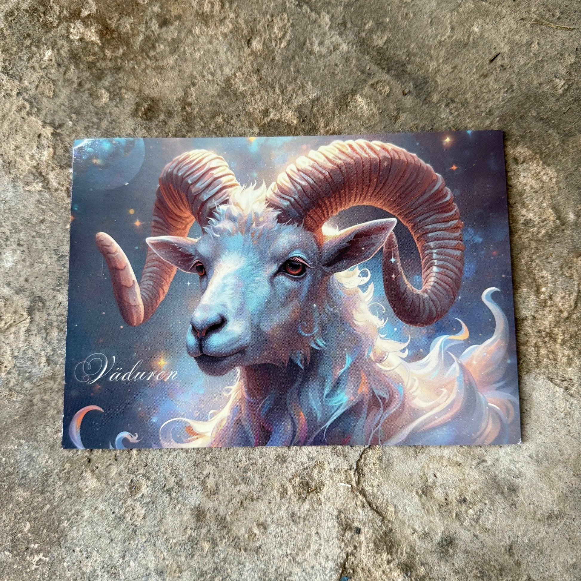 Card with a fantasy ram eller vädur design on a textured surface