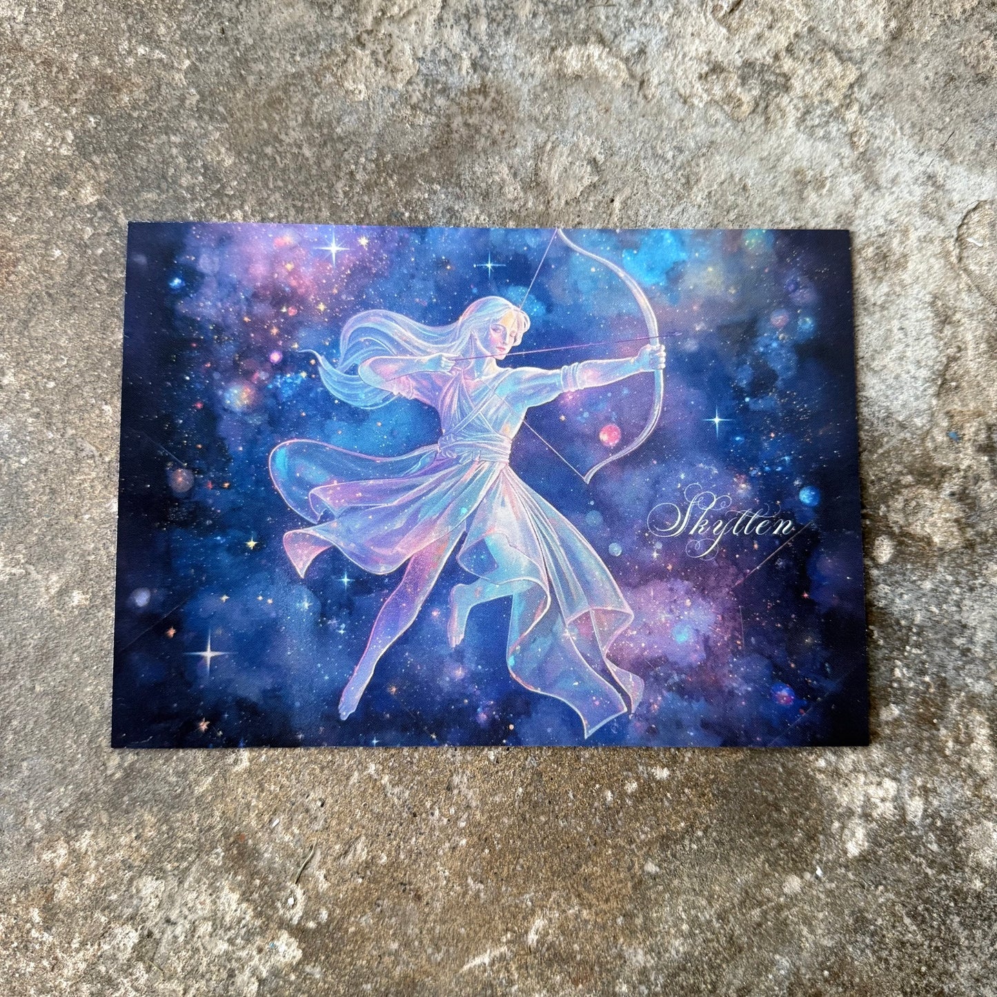 Fairy with a bow against a starry sky on a textured surface for the star sign of sagittarius