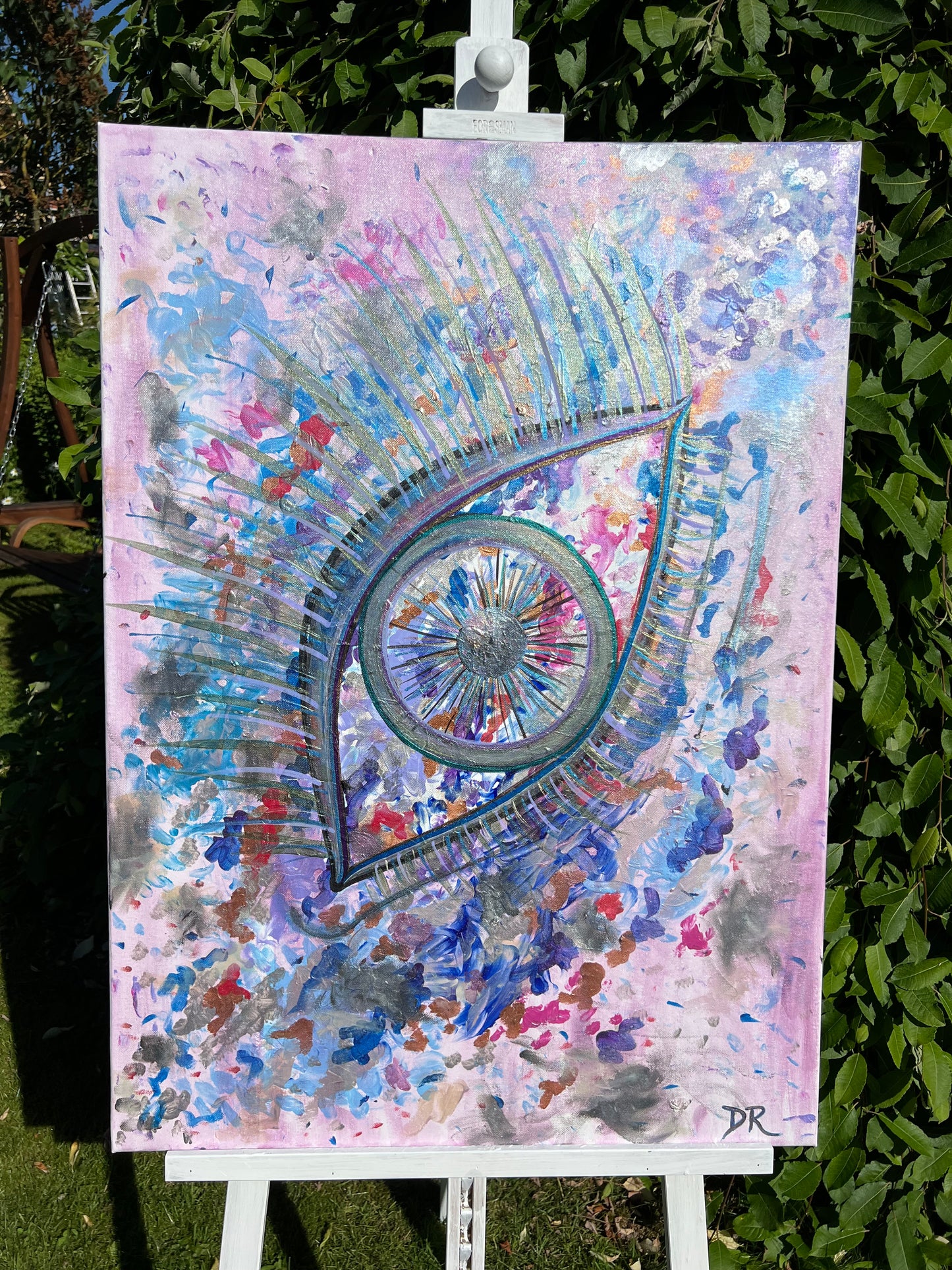 Colorful abstract artwork with a prominent eye design on a colorful background.