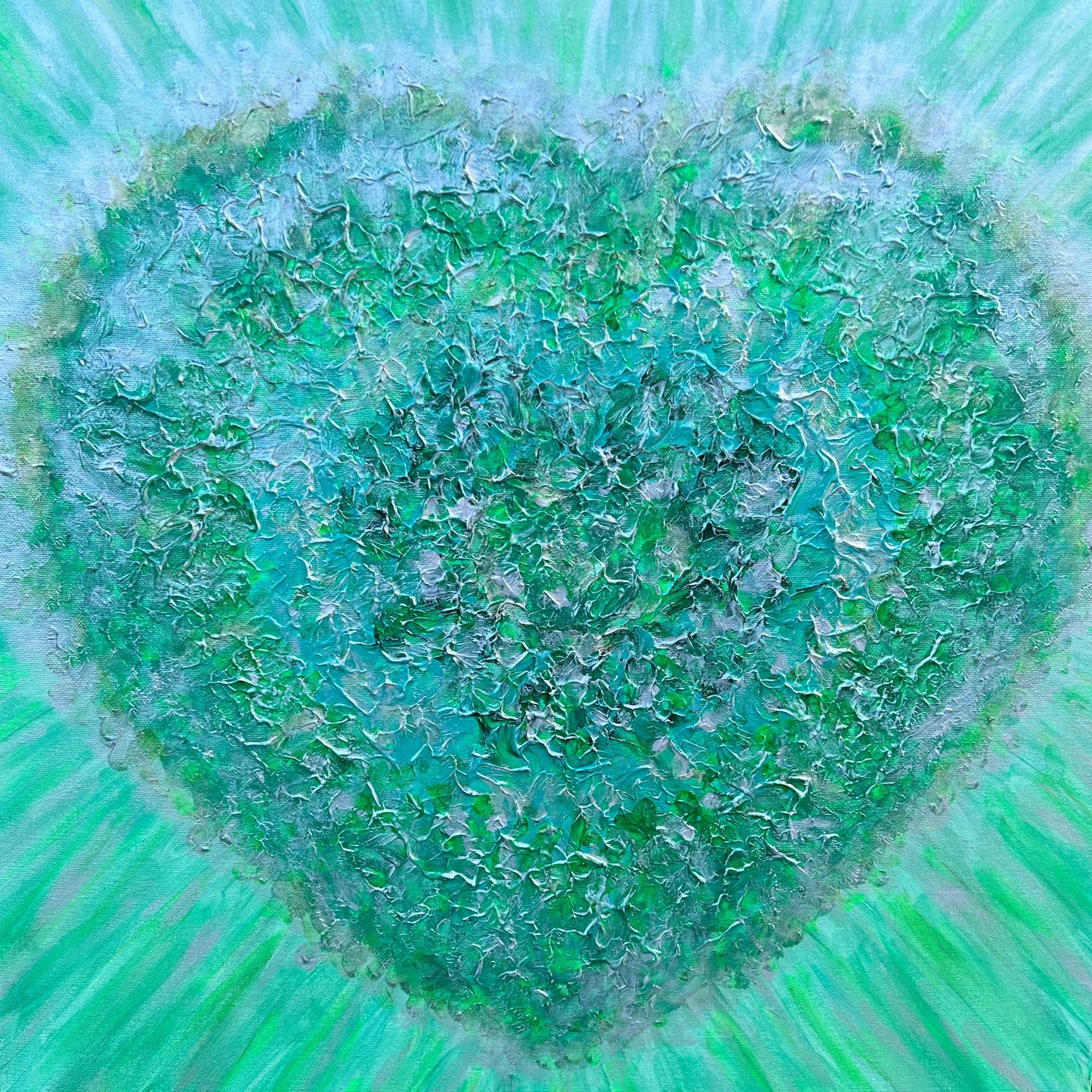 Heart-shaped emerald green artwork on canvas