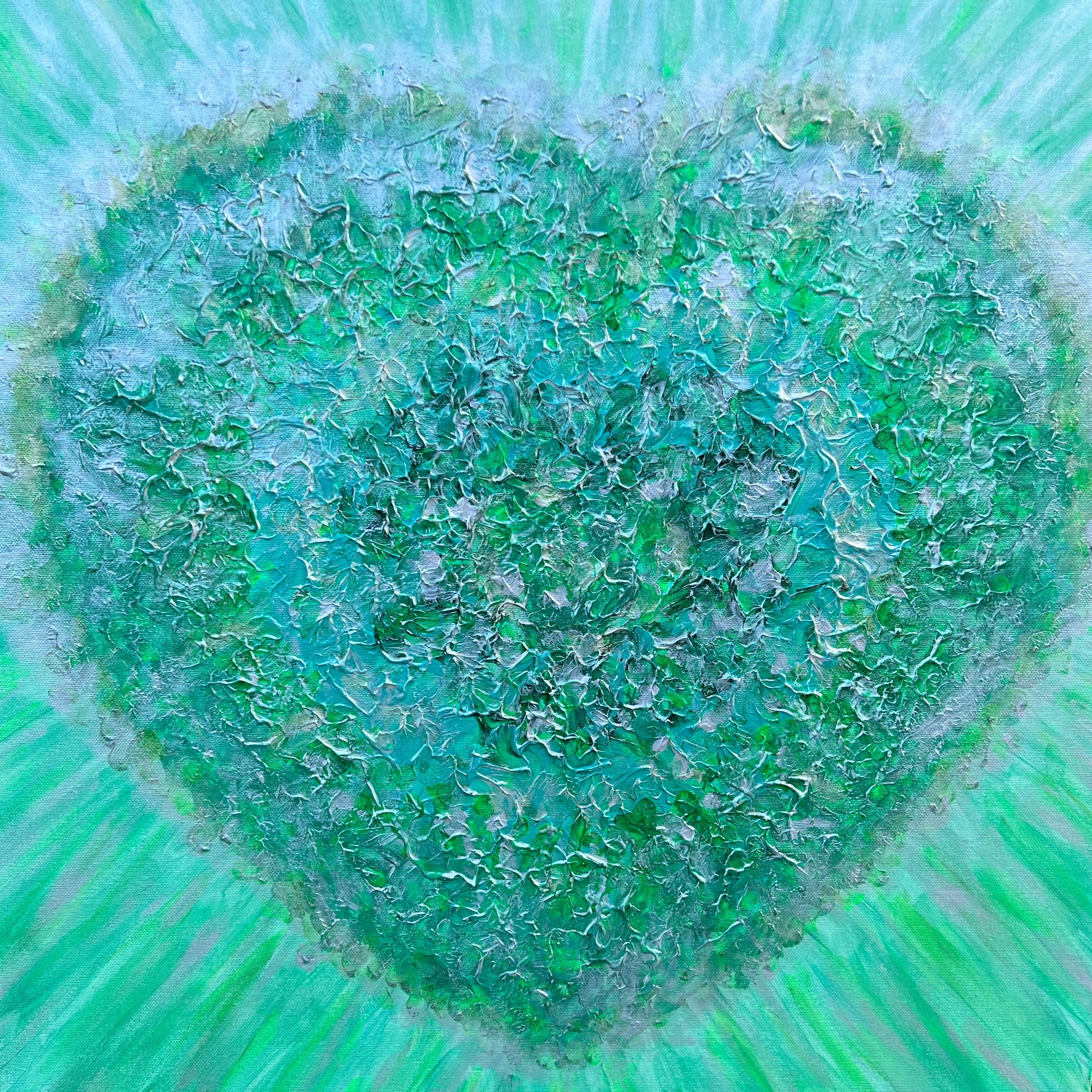 Heart-shaped emerald green artwork on canvas