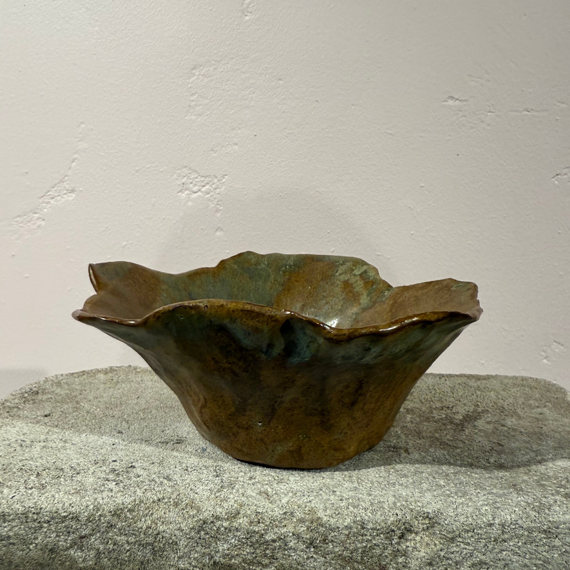 Ceramic shard on a textured surface