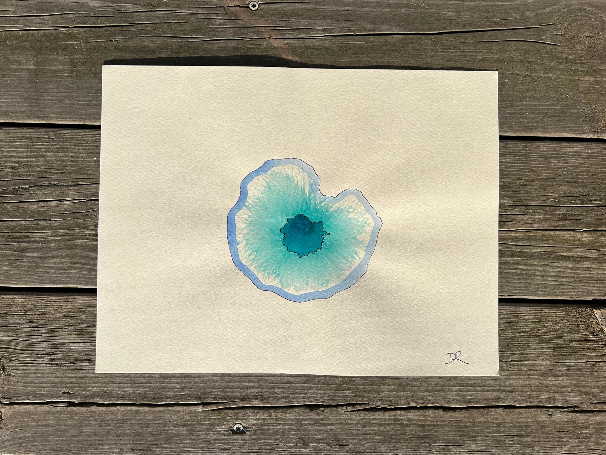 watercolor painting A4 of a blue and turquoise eye on beige fabriano paper