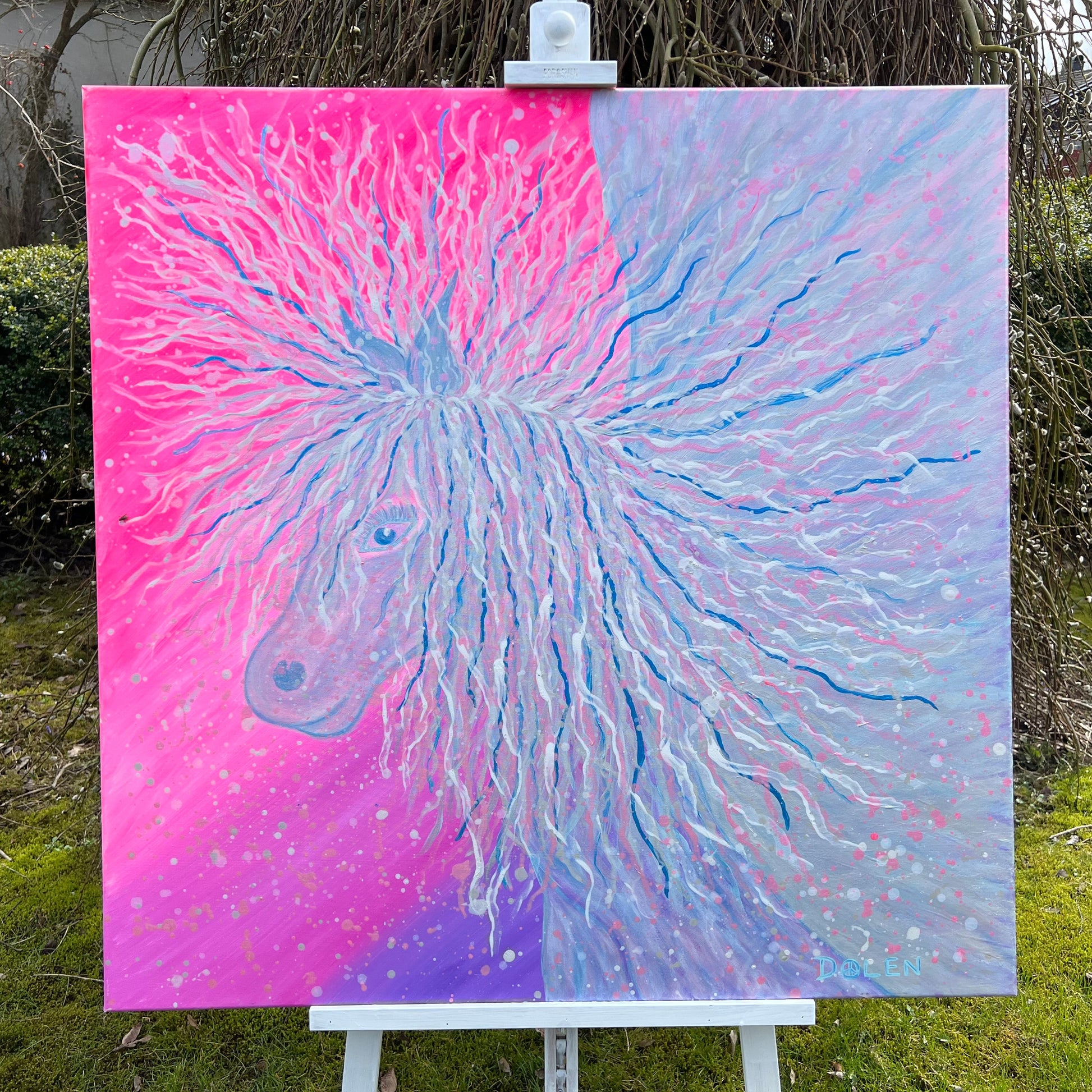 whimsical painting of a fairy pegasus on an easel outdoors