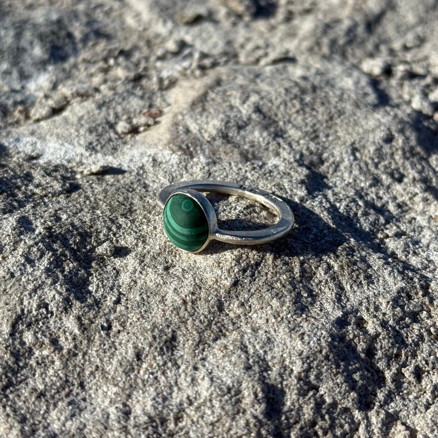flat hammered silver ring with malachite gemstone