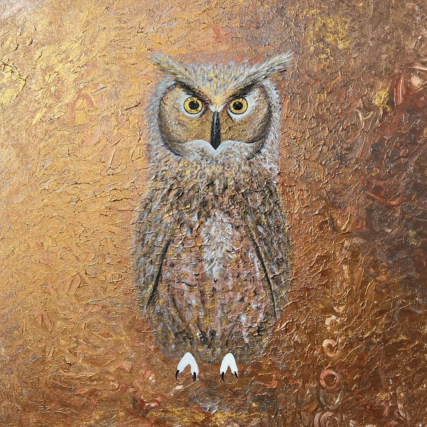 Owl on a textured brown and golden background